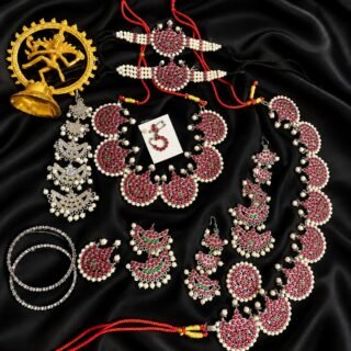Traditional Indian layered kemp-stone and pearl multi-tier haram necklace with ruby and green stone accents.